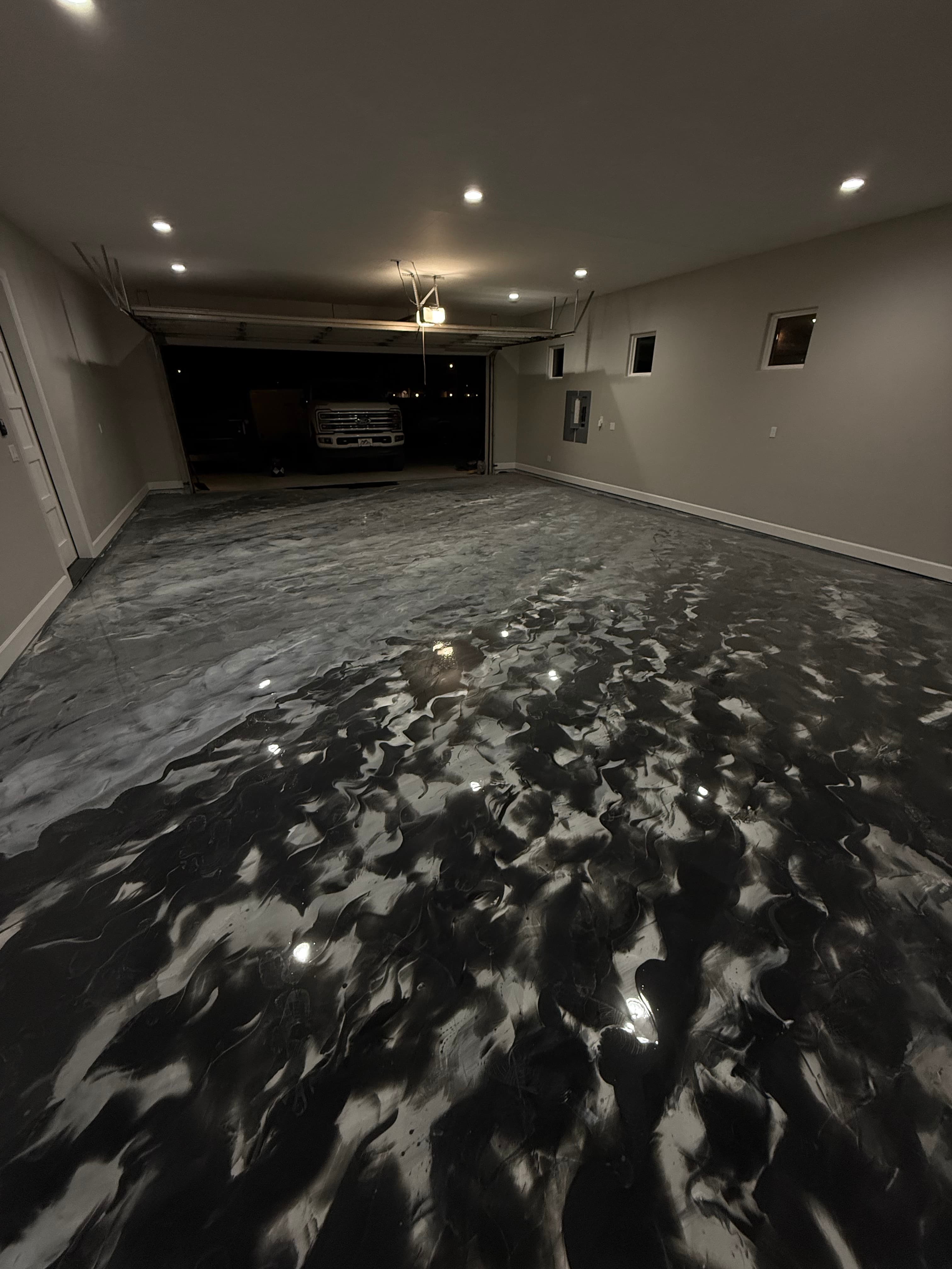 Finished metallic epoxy floor installation by Resin Bros